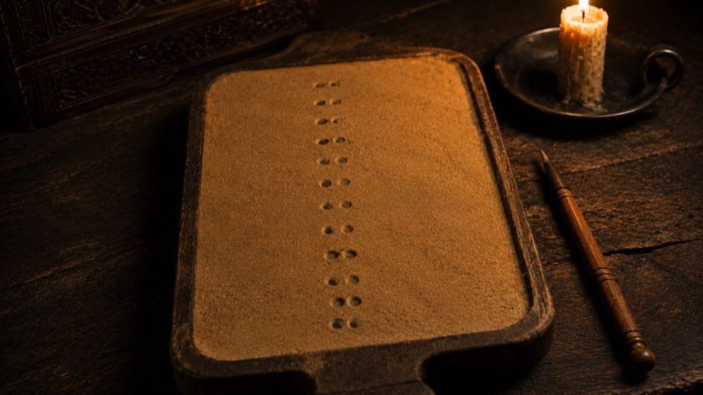 Geomancy — sixteen figures marked in sand from the Arabic ilm al-raml tradition.